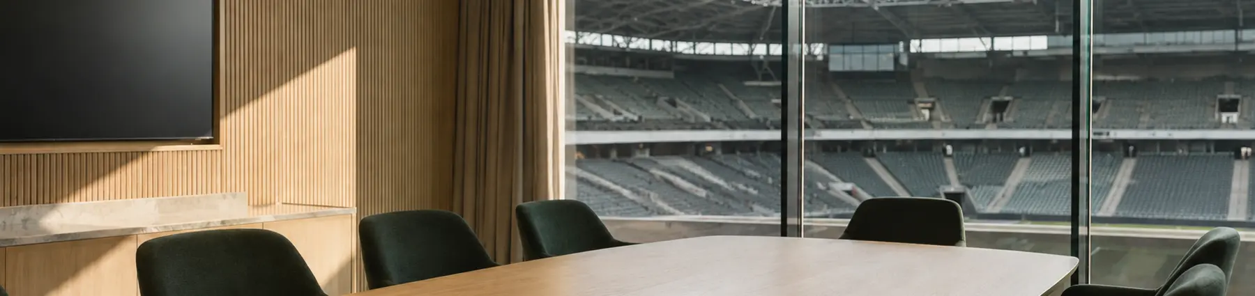 Modern football club boardroom overlooking the stadium